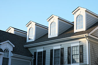Roofline of dormer windows with rain gutters