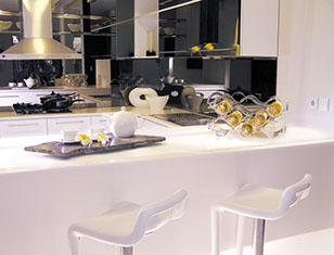 Contemporary kitchen with white countertops
