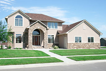Green yard with trees and new home