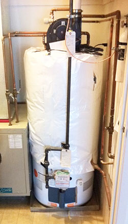 Gas-powered water heater with insulted jacket